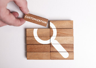 Business, Technology, Internet and network concept. Young businessman shows the word: Customization © photon_photo