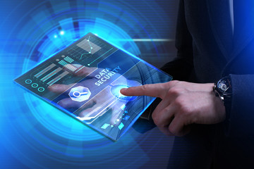 Business, Technology, Internet and network concept. Young businessman working on a virtual screen of the future and sees the inscription: Data security