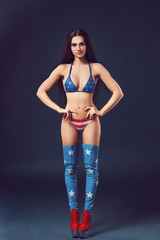 Young and beautiful dancer posing in studio
