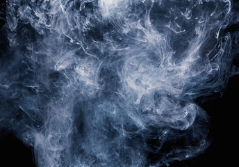Abstract pattern of white smoke on a black background. Waves of mist and clouds.