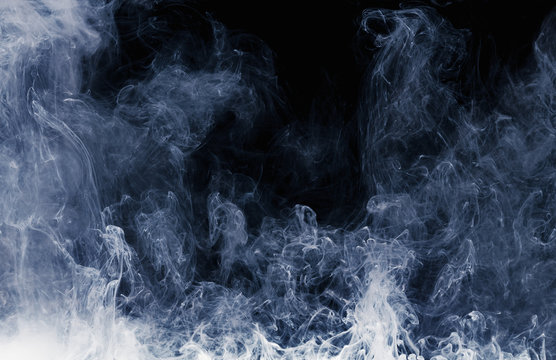 Abstract pattern of white smoke on a black background. Waves of mist and clouds. © bravissimos