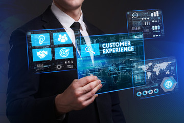 Business, Technology, Internet and network concept. Young businessman working on a virtual screen of the future and sees the inscription: Customer experience