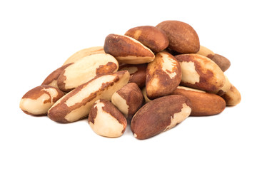 Bunch of raw Brazil nuts on white background