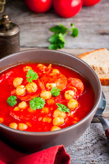 Tomato soup with chickpeas and chorizo, selective focus