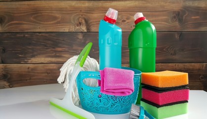 Spring cleaning concept with supplies, colorful background