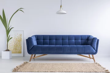 Foto op Plexiglas Blue sofa and wicker carpet © Photographee.eu