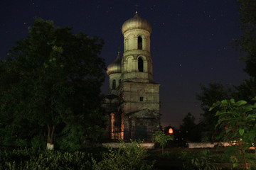 Fototapeta na wymiar Old church in the night sky with stars. Suvorovo, Ismail, Odessa, Ukraine.