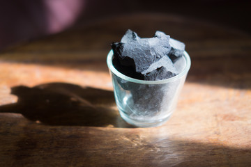 Charcoal arranged in a glass vase