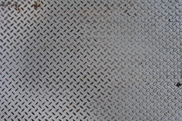 Rusty grey metal surface with notches