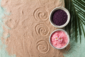 Obraz na płótnie Canvas Spa Concept. Closeup of beautiful Spa Products - Spa Salt and Flowers. Horizontal.