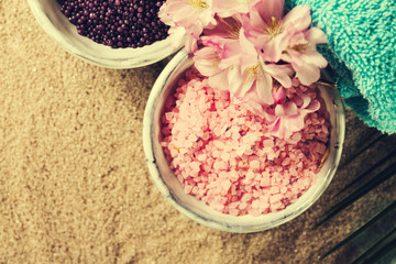 Spa Concept. Closeup of beautiful Spa Products - Spa Salt and Flowers. Horizontal.