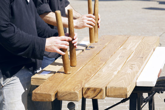 Txalaparta outdoors, in a sunny day. The txalaparta is a percussion musical instrument, a specialized Basque music device made of wood or stone.