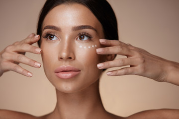 Woman With Smooth Soft Skin And Concealer Under Eyes. Cosmetics