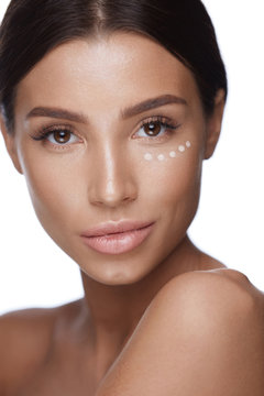 Beauty Cosmetics. Closeup Of Woman With Concealer Under Eyes