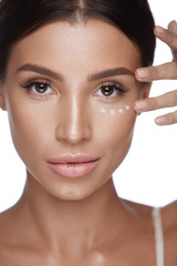 Beauty Woman Face With Makeup And Corrector Under Eyes © puhhha