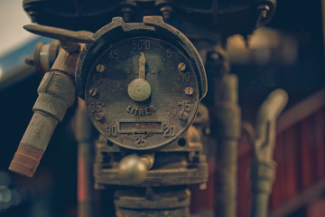 Rust steel oil nozzle fuel gauge measurement.