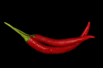 heap of red chili pepper isolated on black