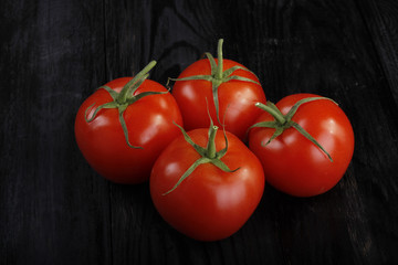 tomatoes on wooden background