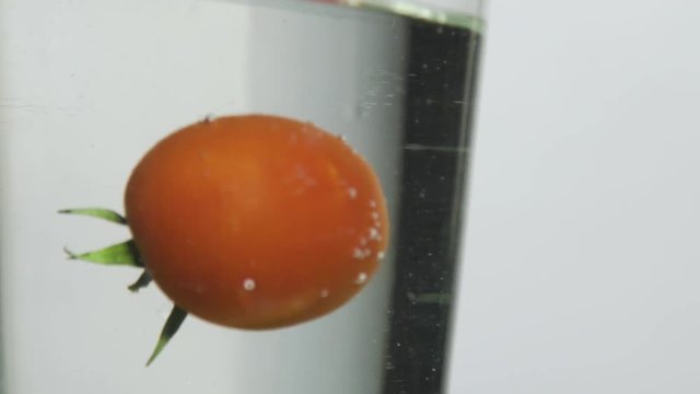 singl tomato Falling into Water