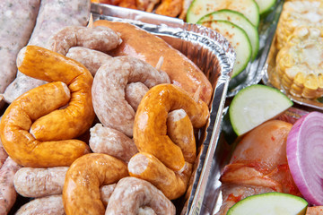 Marinated meat and vegetables prepared for grilling