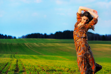 portrait of a beautiful girl in a field