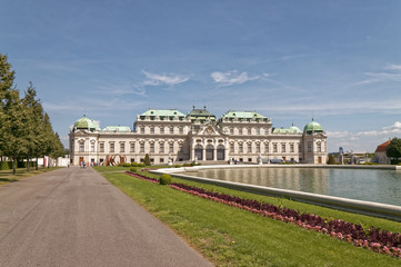 A path at the pond with the palace in the background.