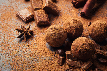 Chocolate truffle,Truffle chocolate candies with cocoa powder.Homemade fresh energy balls with chocolate.Gourmet assorted truffles made by chocolatier.Chunks of chocolate and coffee beans