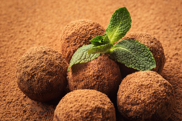 Chocolate truffle,Truffle chocolate candies with cocoa powder.Homemade fresh energy balls with chocolate.Gourmet assorted truffles made by chocolatier.Chunks of chocolate and coffee beans