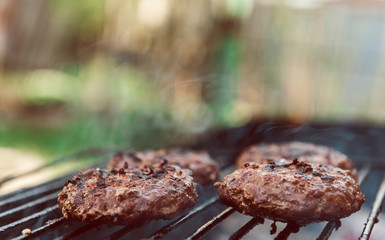 Juicy burger cutlets for burger are grilled