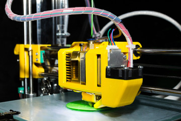 3d printer in operation, prints a new product, close-up.