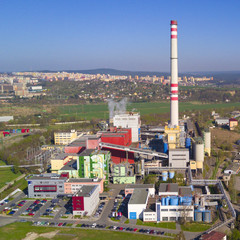 Aerial view of heating plant and thermal power station. Combined modern power station for city district heating and generating electrical power. Industrial zone from above.