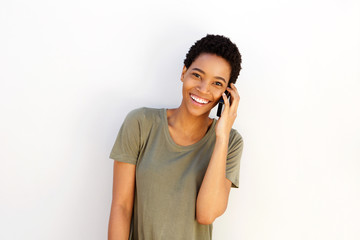 beautiful young black woman smiling with cellphone
