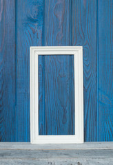 White frame on a background of blue boards