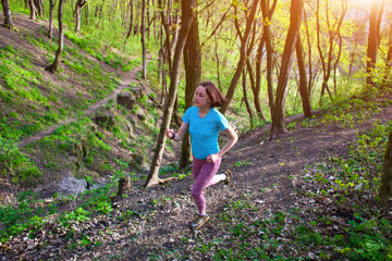 Girl running in the woods..