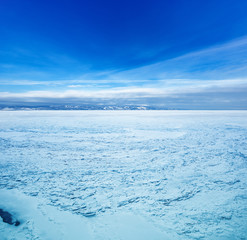 Fototapeta na wymiar Frozen surface of Baikal lake at sunny day time.