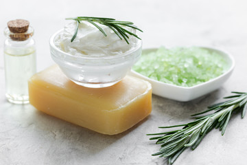 organic cosmetics with rosemary extract on stone table background