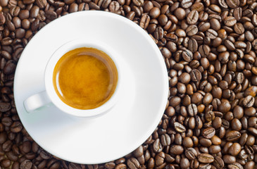 Coffee Cup and Beans on Wooden Table