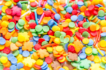 Colorful candies on abstract texture background pattern