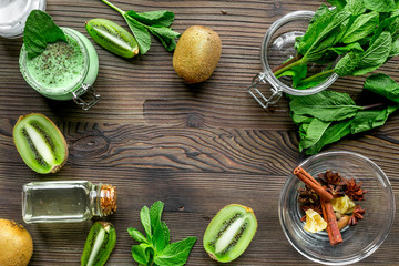 Cosmetic for body with kiwi scrub table background top view mockup