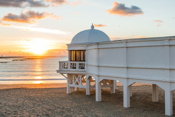 Romantic sunset at Cadiz beach with famous pier © marcin jucha