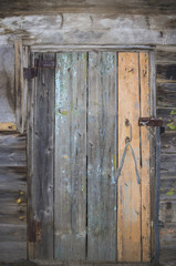 Fototapeta na wymiar Old wooden door rusty canopies