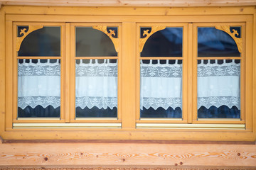 Two windows of a wooden house, Poland