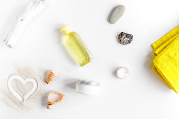 Naklejka premium cream and lotion cosmetic for sun protection on white background top view