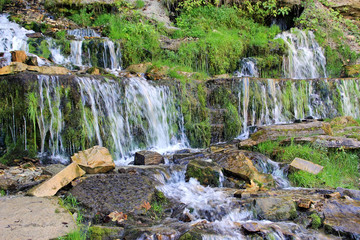 Hillside and cascade of the waterfalls