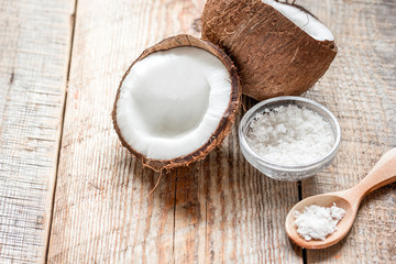 cosmetic concept with fresh coconuts on old wooden table background