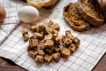 traditional sliced bread with crumbs wooden table background