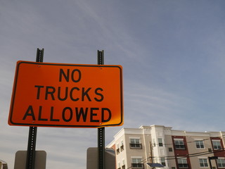 Orange No Trucks Allowed sign