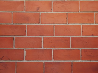 Brown orange brick wall staggered stacked