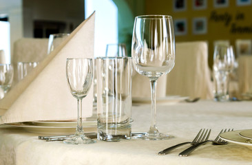 catering table set service with silverware, napkin and glass at restaurant before party