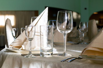 catering table set service with silverware, napkin and glass at restaurant before party